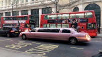 Red double deckers and pink limos